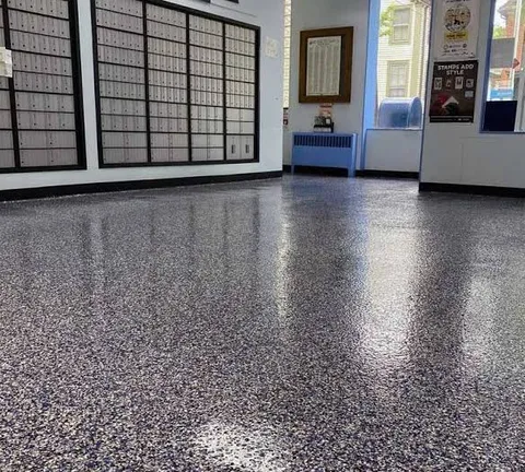 Post office lobby with mailboxes and a high-gloss blue and gray flake epoxy floor